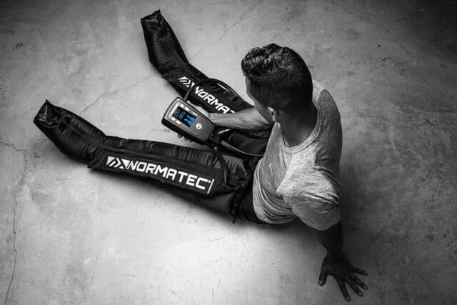 normatec guy sitting